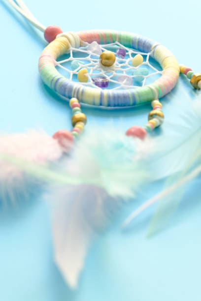 istock Close up of dream catchers on blue background 1206561314