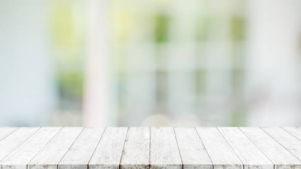 istock Empty wood table top and blurred of interior restaurant with window view green from tree garden background background - can used for display or montage your products. 1206562263