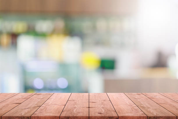 istock Empty wood table top and blurred coffee shop and restaurant interior space background - can used for display or montage your products. 1206562267