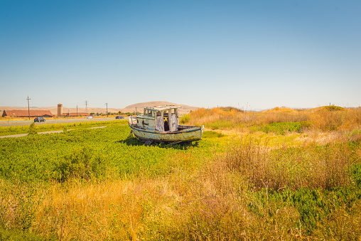 Abandoned boat near the road