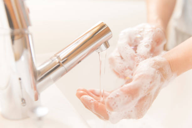 washing hands with soap - washing hands hygiene human hand faucet imagens e fotografias de stock