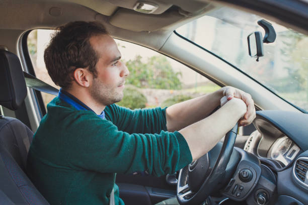 Car driver waiting in a traffic jam on the road.