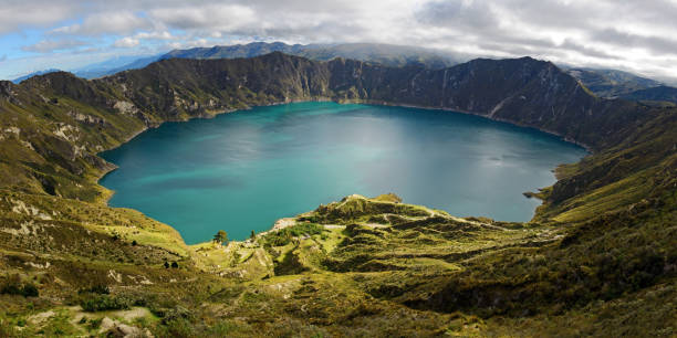 Quilotoa Lagoon Panorama, Ecuador Panorama of the turquoise volcano crater lagoon of Quilotoa along the famous hike called Quilotoa Loop near Quito, Ecuador. quito photos stock pictures, royalty-free photos & images