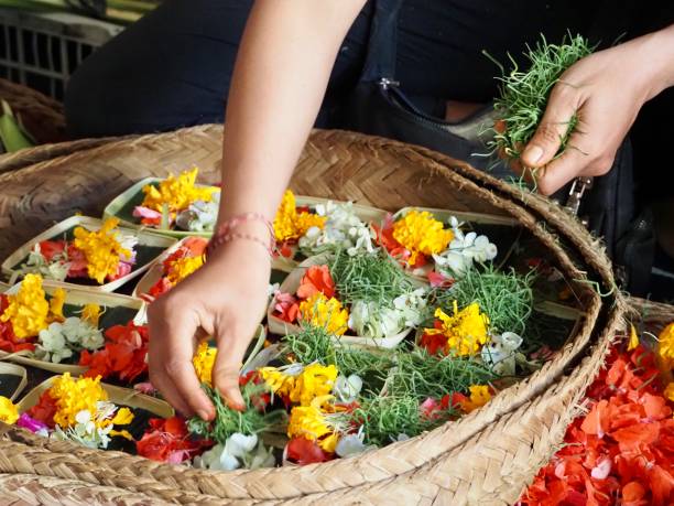 istock Making Flower Offerings on a Market Stall in Ubud - Bali 1206568917