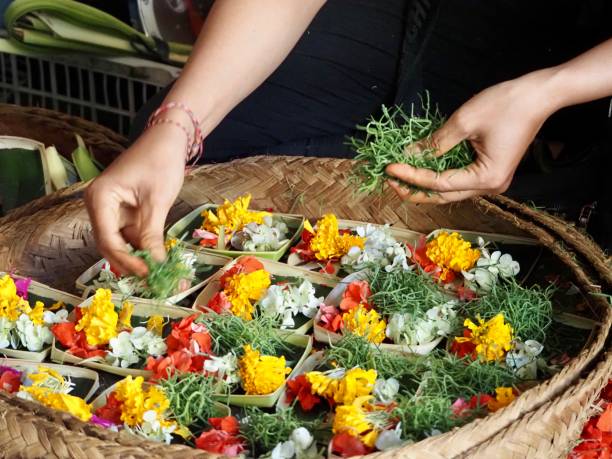 istock Making Flower Offerings on a Market Stall in Ubud - Bali 1206568919