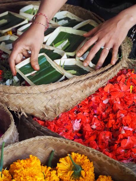 istock Making Flower Offerings on a Market Stall in Ubud - Bali 1206568927
