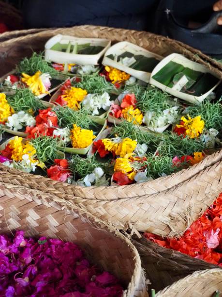 istock Making Flower Offerings on a Market Stall in Ubud - Bali 1206568948