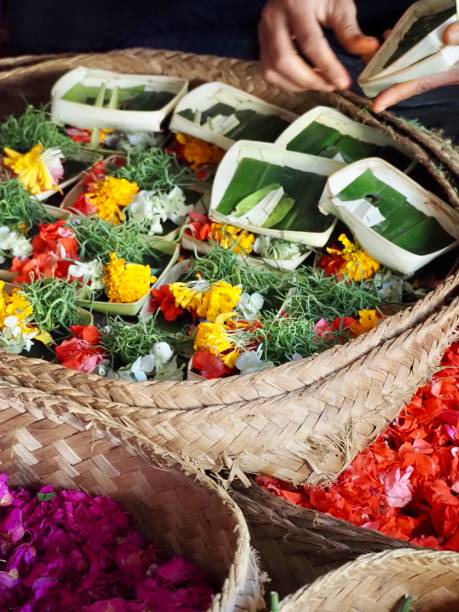 istock Making Flower Offerings on a Market Stall in Ubud - Bali 1206568955
