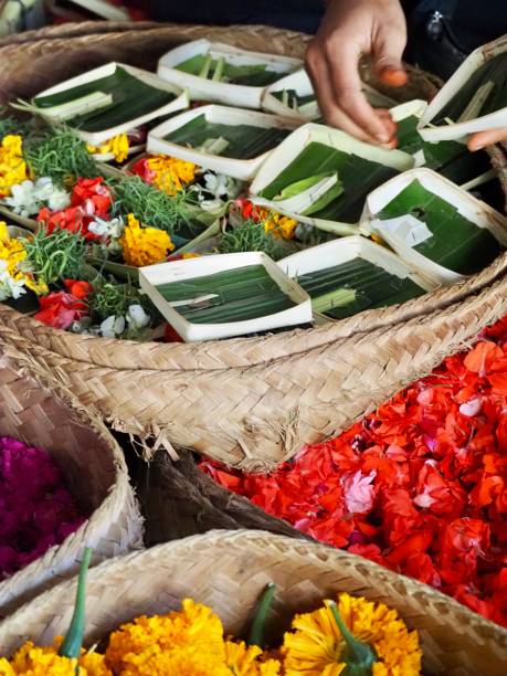 istock Making Flower Offerings on a Market Stall in Ubud - Bali 1206568963