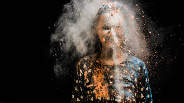 istock girl celebrating holi with colors 1206573501