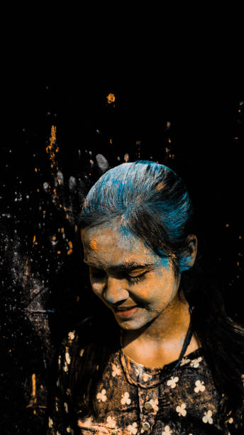 Young teenager girl celebrating holi with colors. holi is a festival of India. It is festival of colors and Joy. It is also called as Dhuleti.
