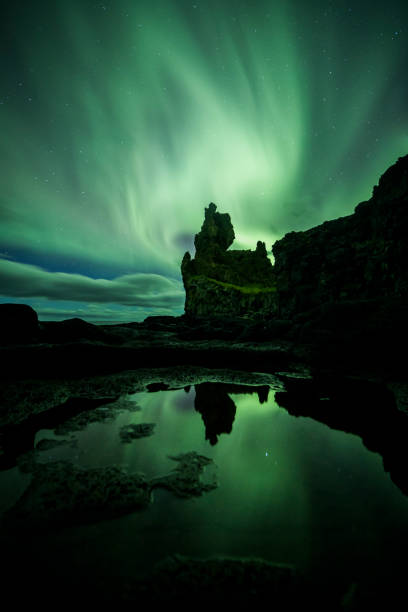 istock Aurora Borealis (Northern Lights) above londrangar rock formation 1206575397