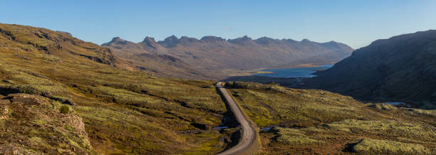 istock Dramatic skies along a long road 1206575483