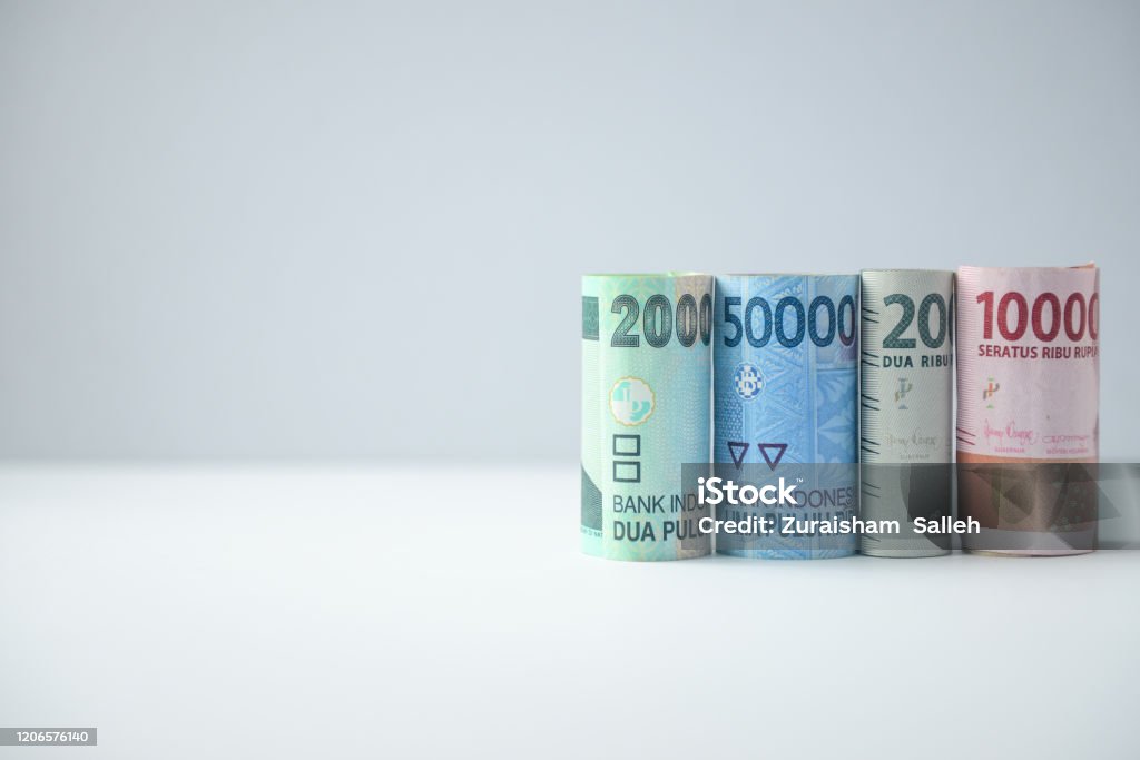 Indonesian Rupiah rolled banknotes on white background Indonesian currency banknotes copy paste Indonesian Currency Stock Photo