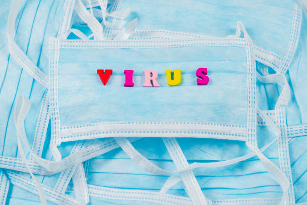 istock Colorful word virus on protective masks. 1206578176