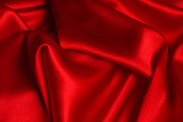 istock Red silk or satin luxury fabric texture can use as abstract background. 1206578179