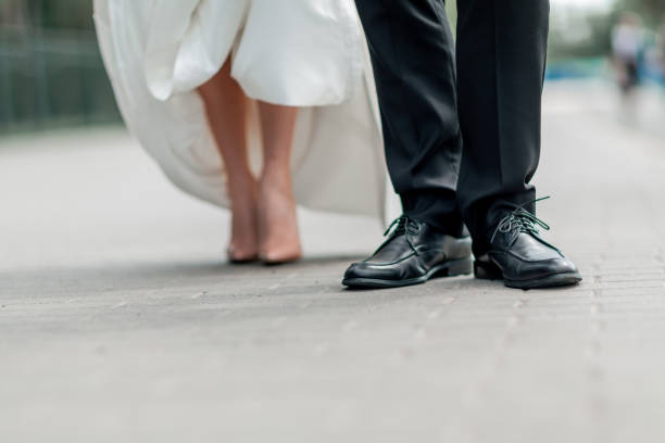 istock close up. the groom standing on the stone sidewalk 1206582888