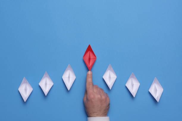 istock Leadership Concept with Paper Ship 1206584310