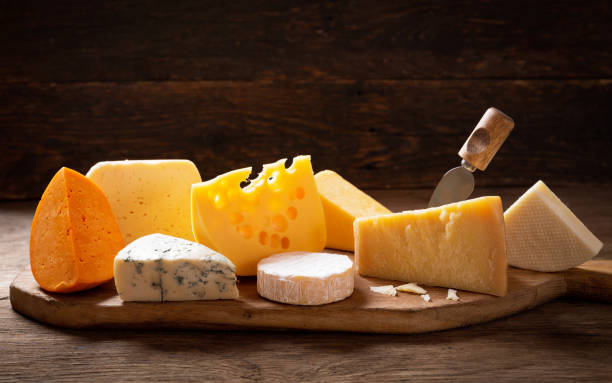 istock various types of cheese on a wooden background 1206585115
