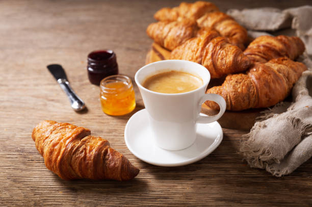 istock breakfast with cup of coffee, croissants and jam 1206585362