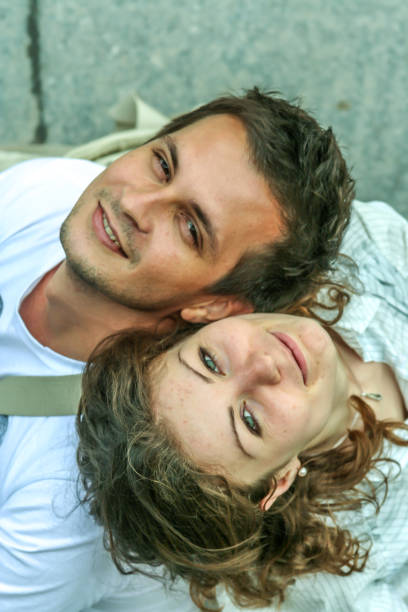istock A young man and woman sitting back to back 1206585725