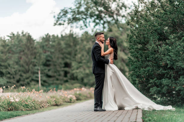 istock in full growth. bride and groom looking at each other tenderly 1206586607
