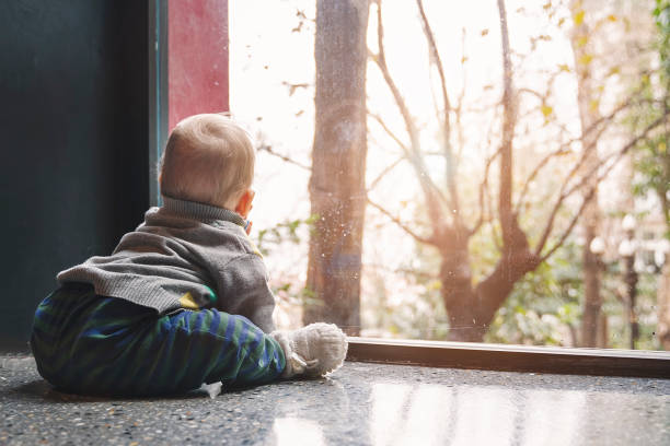 istock Little baby boy crawling on floor 1206587791