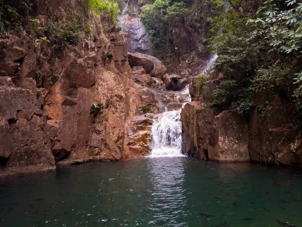 istock stone and water in Pliew waterfall at Chuntaburi Thailand 1206588249