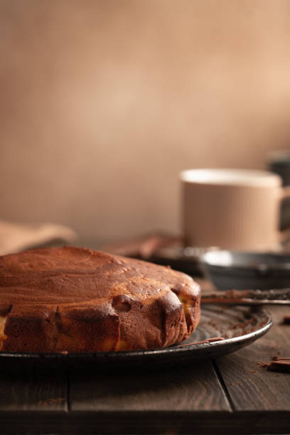 istock Homemade baking. Fragrant zebra cake with a crispy crust on a plate with coffee and chocolate 1206589132