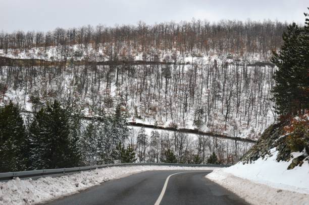 istock mountain road, winter in the snow 1206590174