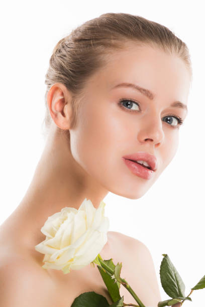 istock Woman with rose on white 1206590983