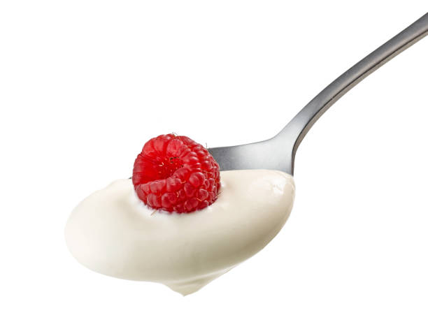 istock spoon of yogurt cream with raspberry 1206593879