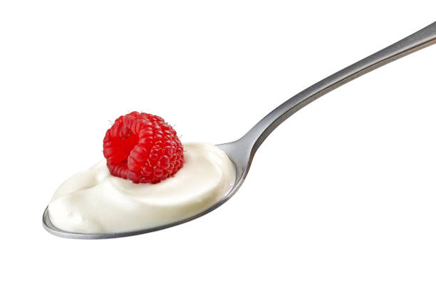 istock spoon of yogurt cream with raspberry 1206593883