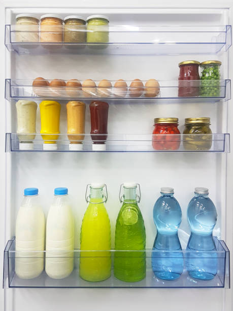 istock Open fridge refrigerator full of food and drinks 1206594120