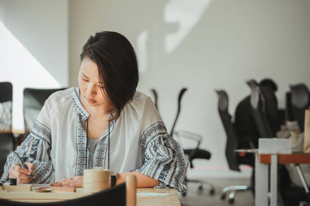 istock Asian women practice modern calligraphy 1206595233