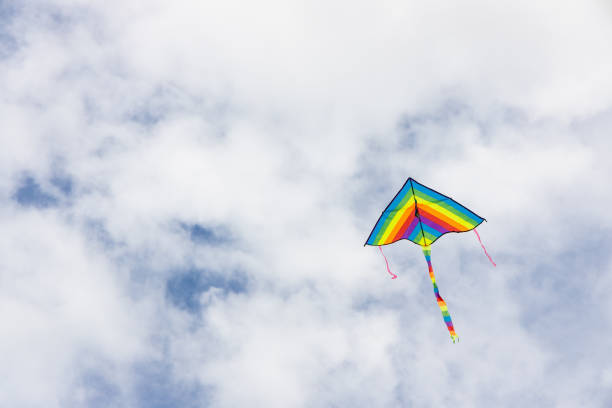 istock Coloful kites flying against blue sky with copy space 1206595447