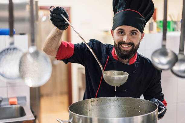 istock Young male chef cooking in the restaurant kitchen 1206596846