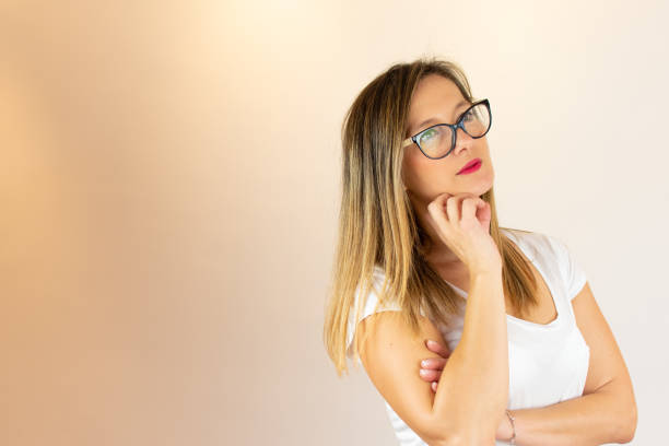 istock Young woman thoughtful with glasses 1206597233