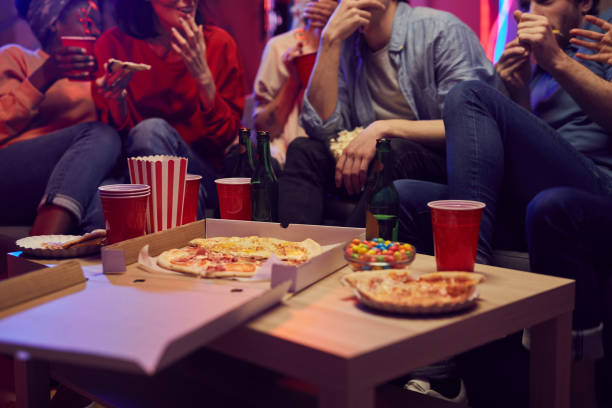 istock People eating pizza at party 1206600510
