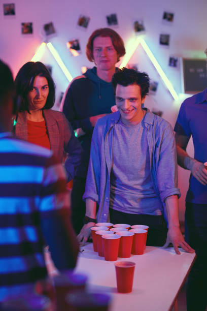 istock People playing in beer pong 1206600790