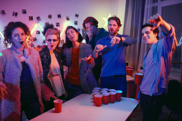 istock People playing in beer pong at home 1206600857