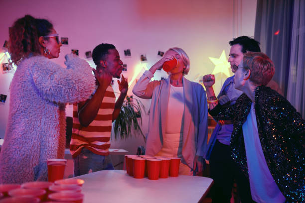 istock Woman drinking cocktail at the party 1206600875