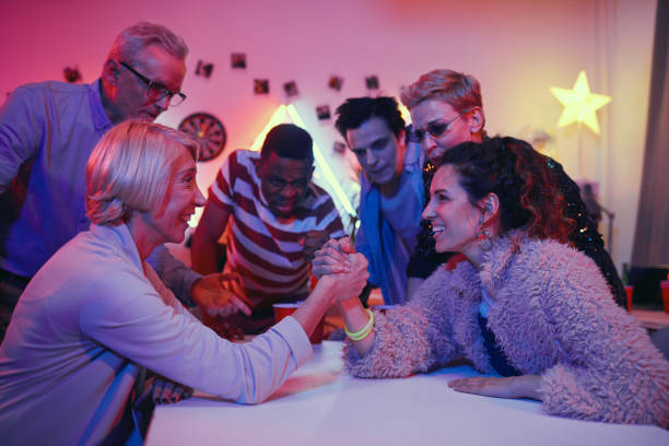 istock Women have a competition at party 1206600962
