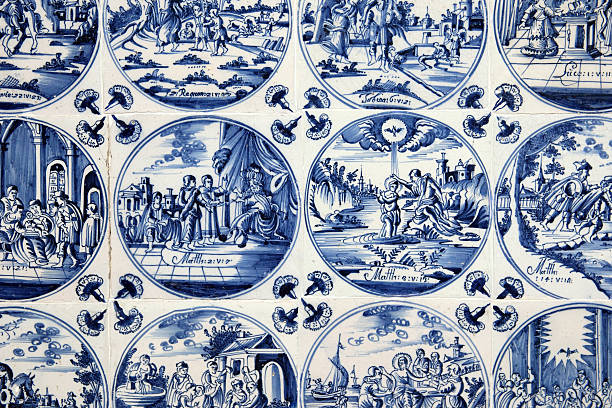 Close up of antique tin glazed blue Delft wall tiles dating from 1750-80, showing biblical scenes