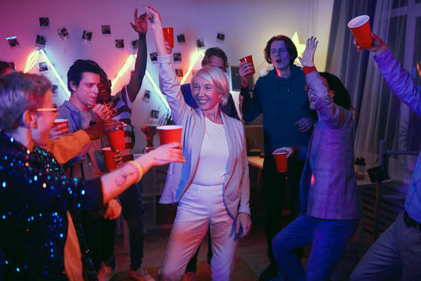 istock Mature woman having fun at the party 1206601067