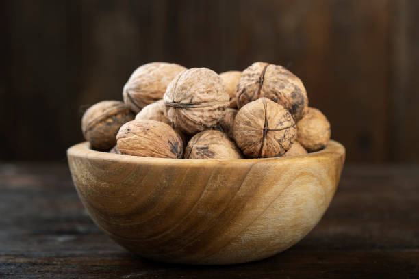 istock Walnut in a wooden bowl 1206601802
