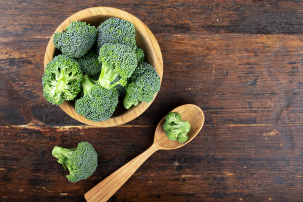 istock Fresh raw broccoli in a wooden bowl. 1206601837