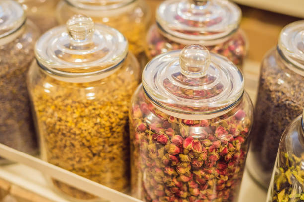 Different types of tea in glass jars.