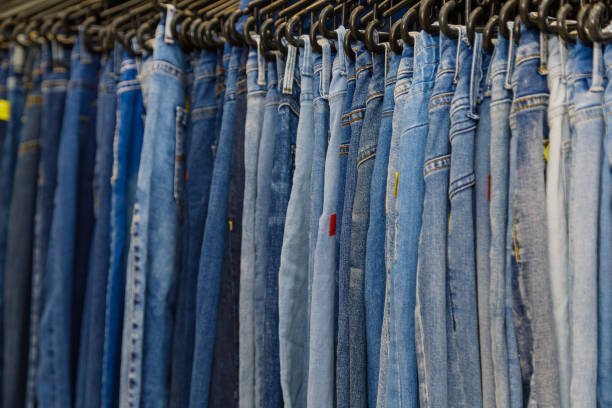 istock Beautiful clothes on hangers in a stylish store 1206602242