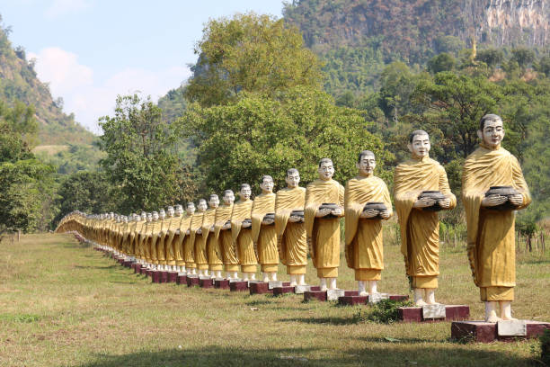 istock Row Buddhist monk statues in Myanmar 1206602341